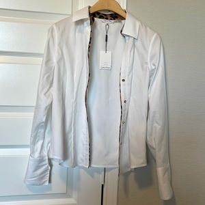Adorable button down white shirt with leopard lining by Calvin Klein size XS